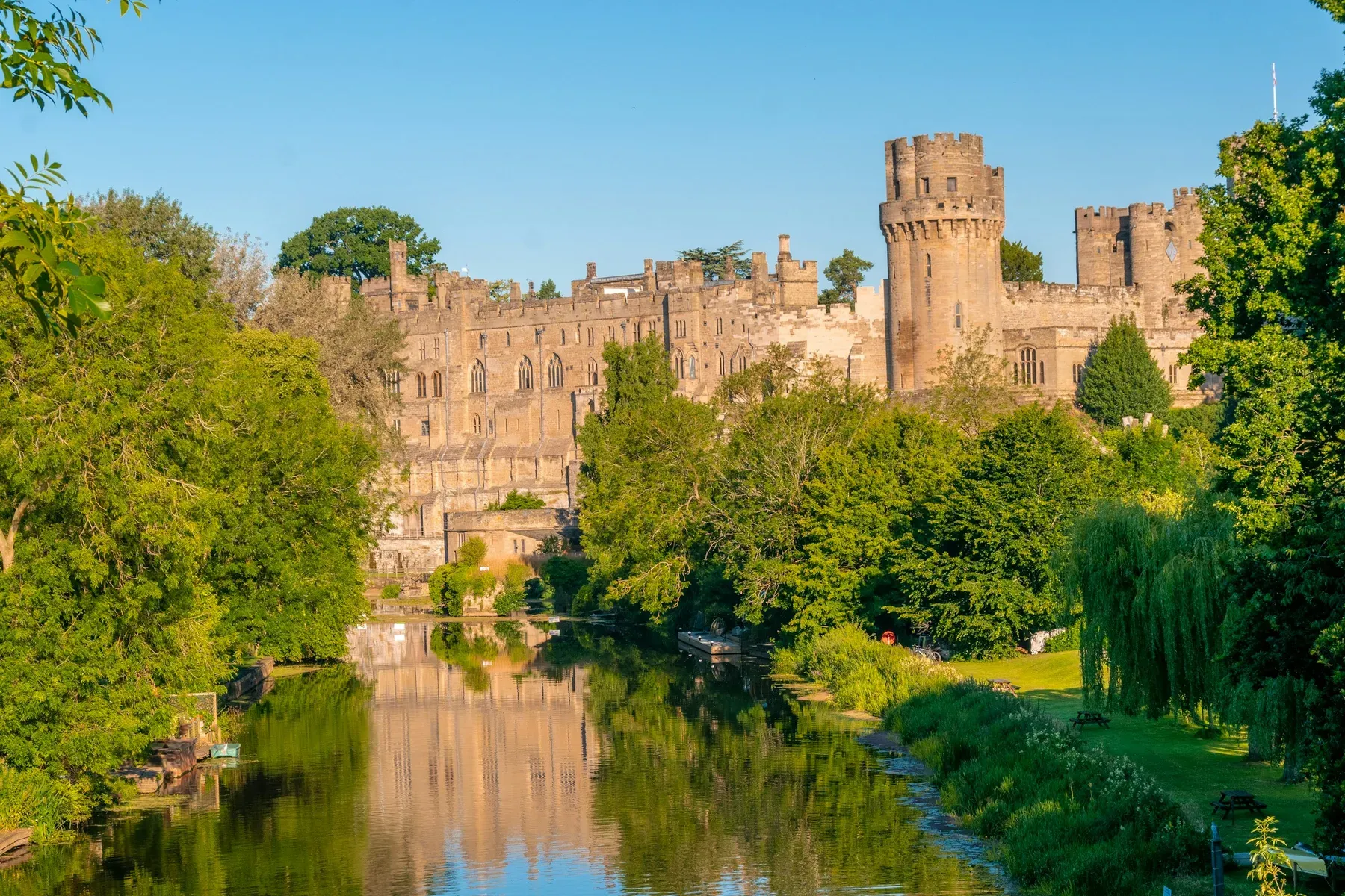 Warwick Castle's towers and curtain wall above the River Avon